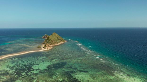 aerial view tropical island in blue lagoon, coral reef and sandy beach. Palawan, Philippines. tropical landscape with island and beache travel concept