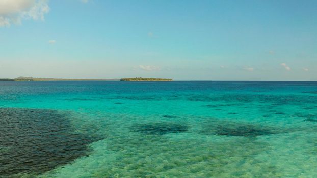 Sea water surface in lagoon with tropical islands copy space for text. Summer and travel vacation concept.