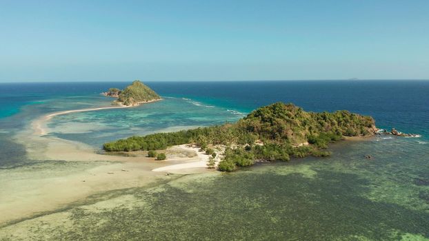 aerial view tropical island in blue lagoon, coral reef and sandy beach. Palawan, Philippines. tropical landscape with island and beache travel concept