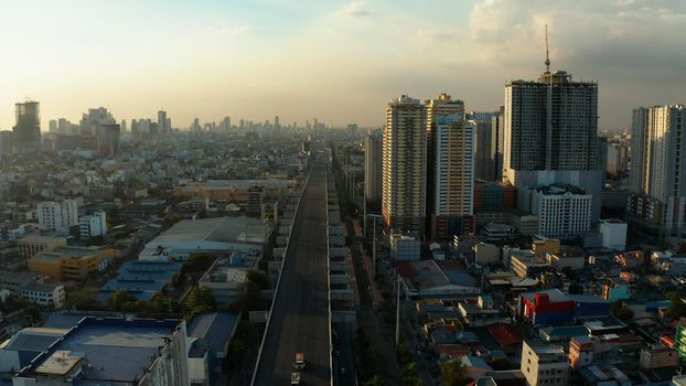 Manila city with skyscrapers, modern buildings and Makati business center, aerial drone. Travel vacation concept.