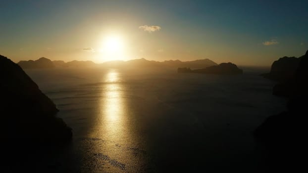 Aerial drone seascape with mountains and rocky islands in the morning time El Nido. sunset over the sea. tropical bay in at sunset. Sunset sky and mountains rocks of bay. Dreamy sunset among the rocks.