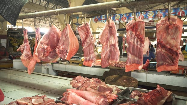 Meat in a street market. Meat from Asian market. Heap of fresh raw meat food flesh background at shop supermarket.