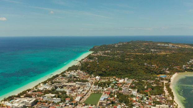 Costline of the tropical island of Boracay with sandy beaches and hotels from above. Summer and travel vacation concept. Philippines.