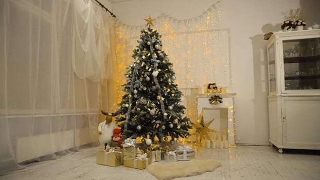 Decorated christmas tree with colorful balls and gifts. Christmas and New Year decorated interior room with presents and New year tree.