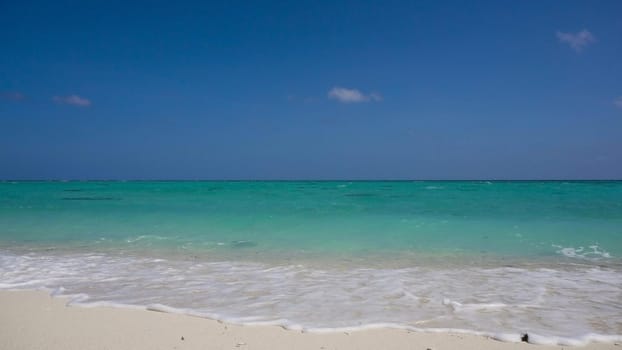Tropical beach with white sand with beach house on a tropical island. Beautiful sky, sea. Seascape: Ocean and beautiful beach paradise. Philippines. Travel concept.
