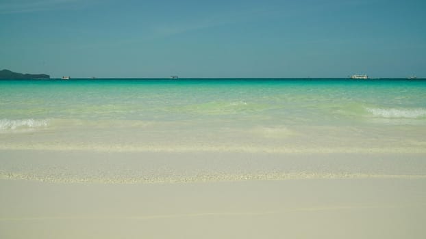 Sandy tropical beach and blue sea against the sky. Boracay, Philippines. Summer and travel vacation concept. Boracay, Philippines