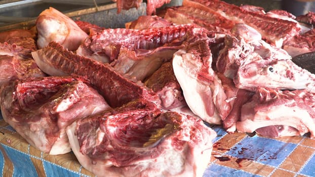 Meat in a street market. Meat from Asian market. Heap of fresh raw meat food flesh background at shop supermarket.
