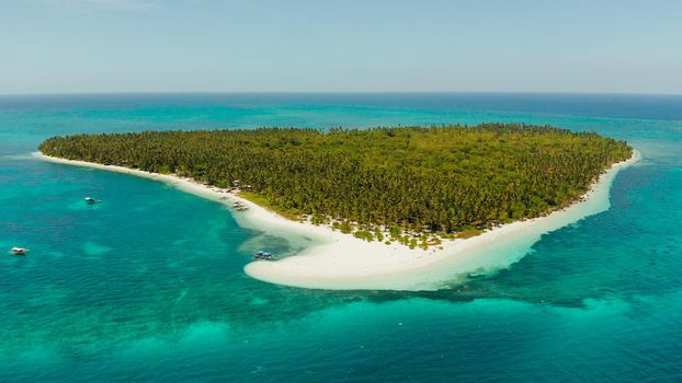 Tropical landscape: small island with beautiful beach, palm trees by turquoise water view from above. Patongong Island with sandy beach. Summer and travel vacation concept.