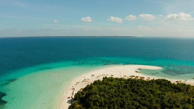 Tropical landscape: small island with beautiful beach, palm trees by turquoise water view from above. Patawan island with sandy beach. Summer and travel vacation concept.