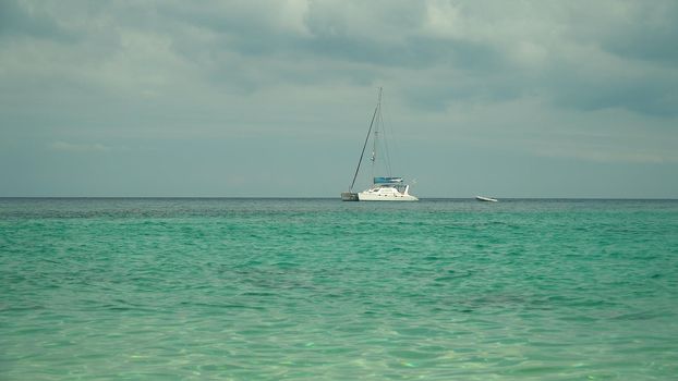 Motor Luxury yacht in the sea against the sky and clouds.