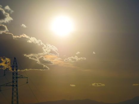 power line at sunset light clouds sky