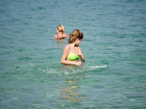 long woman play on the blue sea