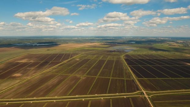 Aerial view of agricultural, cultivated fields. Agricultural landscape. Irrigated farmland