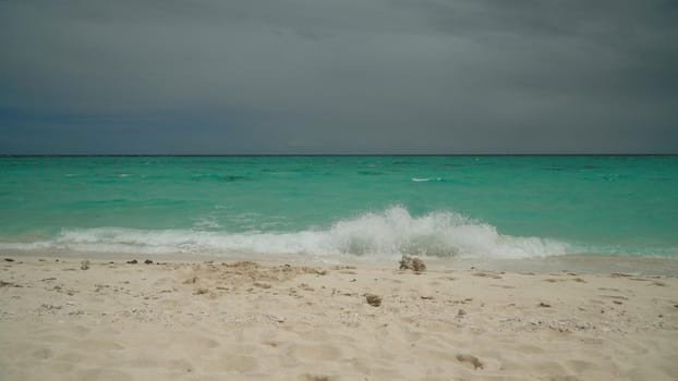 Sandy tropical beach and blue sea. Summer and travel vacation concept.
