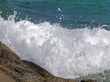 Waves crashing against the rock, natural landscape