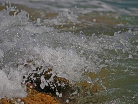 Waves crashing against the rock, natural landscape