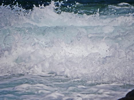 Waves crashing against the rock, natural landscape