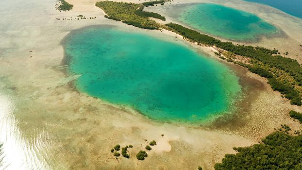 aerial view Honda bay with tropical islands and sandy beaches surrounded by coral reef with azure water, top view. Summer and travel vacation concept, Puerto princesa, Palawan, Philippines.