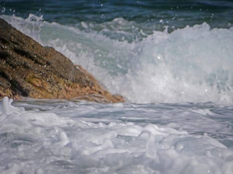 Waves crashing against the rock, natural landscape