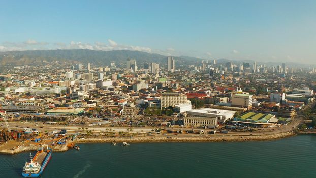 Cityscape: Cebu city with modern buildings, skyscrapers and business centers, top view during sunrise. Philippines.