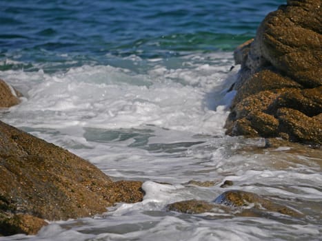 Waves crashing against the rock, natural background