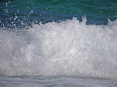 Waves crashing against the rock, natural background