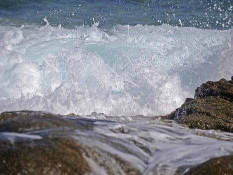 Waves crashing against the rock, natural background