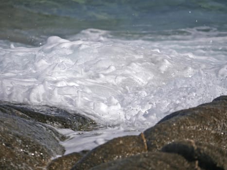 Waves crashing against the rock, natural background