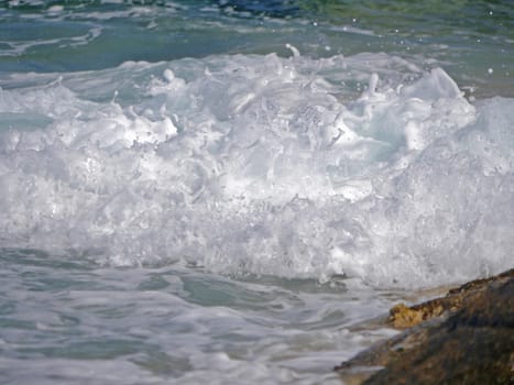 Waves crashing against the rock, natural background