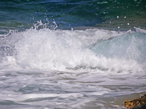 Waves crashing against the rock, natural background