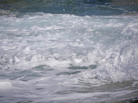 Waves crashing against the rock, natural background