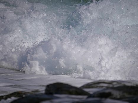 Waves crashing against the rock, natural background