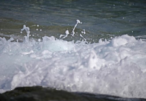 Waves crashing against the rock, natural background