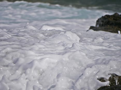 Waves crashing against the rock, natural background