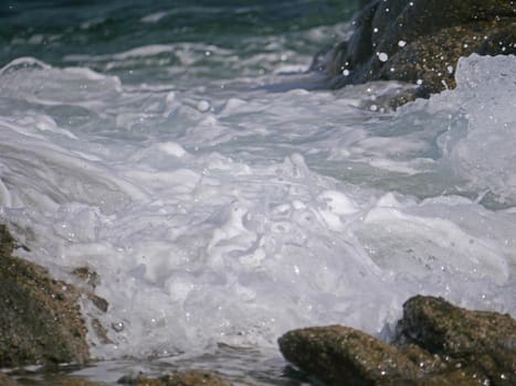 Waves crashing against the rock, natural background