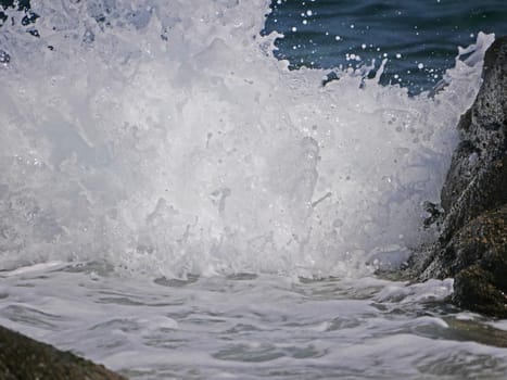 Waves crashing against the rock, natural background