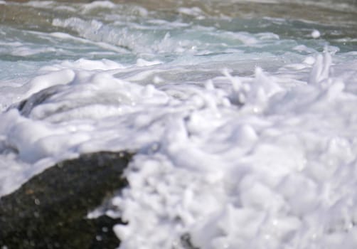 Waves crashing against the rock, natural background