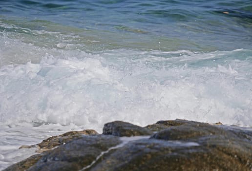 Waves crashing against the rock, natural background