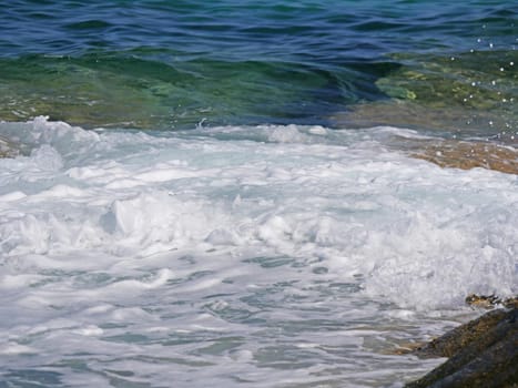 Waves crashing against the rock, natural background