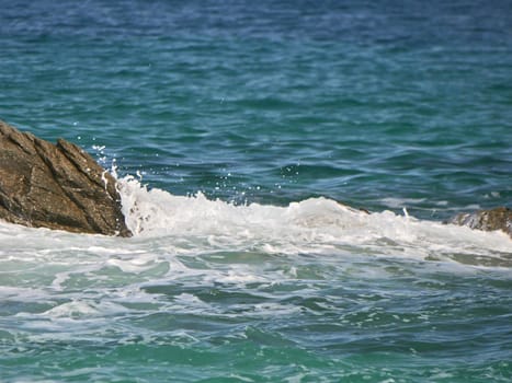 Waves crashing against the rock, natural background