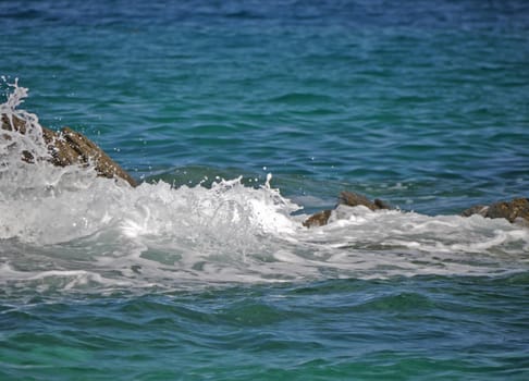 Waves crashing against the rock, natural background