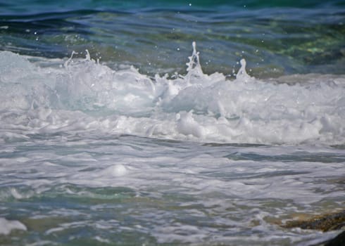 Waves crashing against the rock, natural background