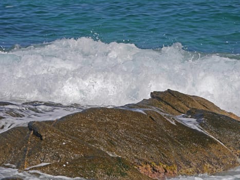 Waves crashing against the rock, natural background