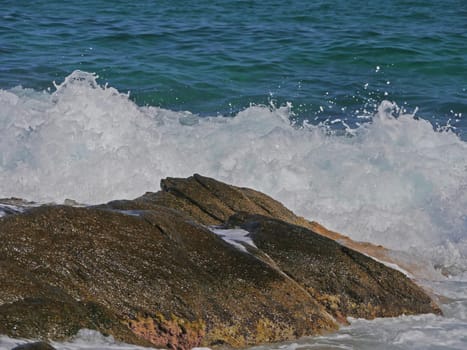 Waves crashing against the rock, natural background