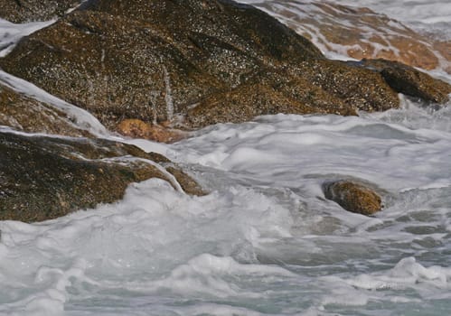 Waves crashing against the rock, natural background