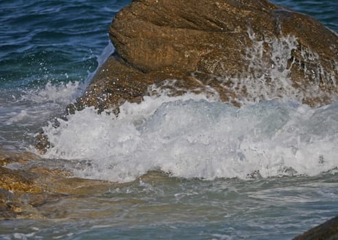 Waves crashing against the rock, natural background