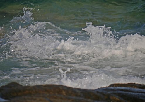 Waves crashing against the rock, natural background