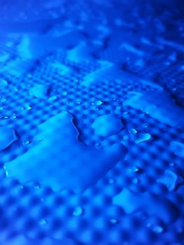 Splashes of water on shower tray highlighted in color 