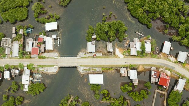 The village and the highway among the mangroves from above. Siargao island, Philippines.