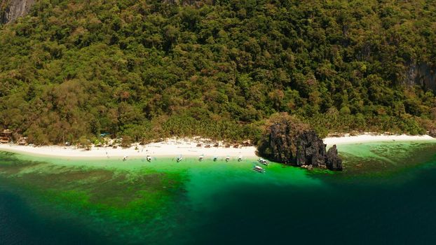 Tropical beach and clear blue water. El nido, Philippines, Palawan. Seascape with tropical rocky islands, ocean blue water. Summer and travel vacation concept